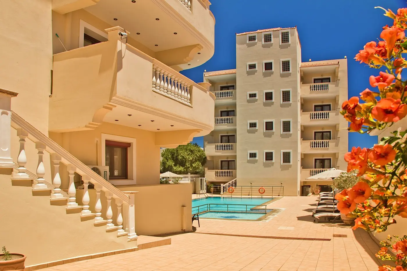 Hotel courtyard with pool and bougainvillea