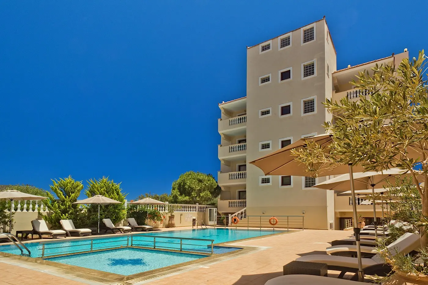 Sun loungers beside the swimming pool
