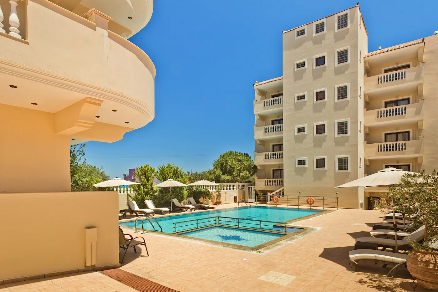 Pool framed by the hotel balconies